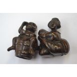 A  Japanese dark wood Netsuke depicting a monkey sat on a barrel, in excellent condition and