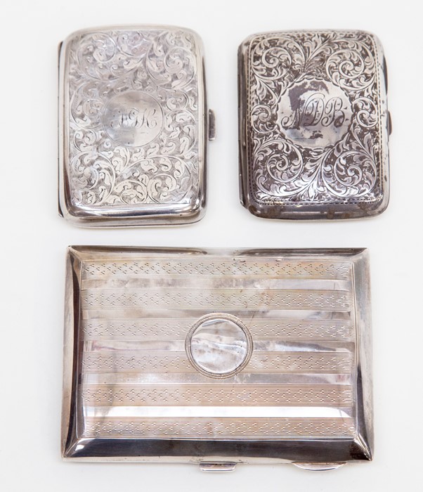 Two Edward VII silver cigarette cases, leafage scroll engraved Birmingham 1907 and 1909 and