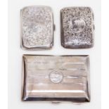 Two Edward VII silver cigarette cases, leafage scroll engraved Birmingham 1907 and 1909 and