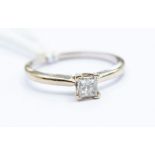 **REOFFER IN A&C NOV £80-£120** A diamond and 14ct gold solitaire ring, the princess cut diamond