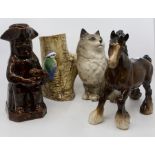 A collection of various ceramics to include a Beswick cat, shire horse. Treacle glazed Staffordshire