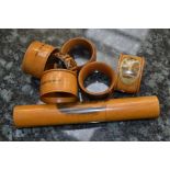 A group of Mauchline ware napkin rings, Tunbridge Ware napkin rings, Mauchline ware pencil holder