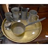 A metal collection to include; a brass tray, brass pot and five pewter mugs (Q)