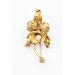 A gold and pearl flower brooch, stamped 12k LC, length approx. 50mm, approx 5cm long, total gross