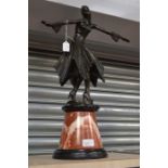 Art Deco style bronze figure of a dancing lady on a marble plinth, elaborate detail to bonnet and