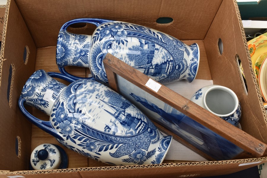 A pair of large Delft pottery vases with harbour scenes, matching smaller ginger jar and a large