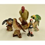 A collection of Beswick birds to include a Kingfisher, Woodpecker, Thrush, Parakeet, along with a