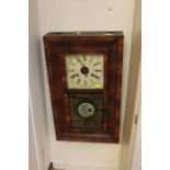 An Art Deco mahogany wall hanging glazed clock with roman numerals.