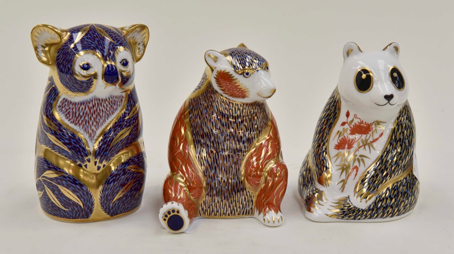 Royal Crown Derby paperweights of a koala, panda and a bear, with silver stoppers