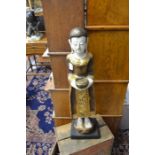 A carved and painted wooden Oriental figure, approx 69 cms in height