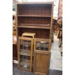 An Early 20th Century pine bookcase, fitted with four fixed shelves, on a platform base. H 207cm,