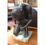 A bronze figure of a male athlete on a marble base, circa 1910