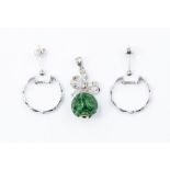 A pair of 18ct white gold hoop earrings and an 18ct white gold pendant suspending carved jadeite