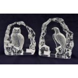 A pair of glass sculptures one depicting an eagle and another of an owl
