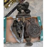 A box of assorted cast iron and similar wares, to include a Mr Punch doorstop
