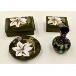 Two early to mid Moorcroft lidded dishes, green ground, pin dish and vase (one dish A.F)