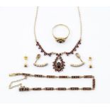 A 15ct garnet set suite comprising a ring, bracelet, necklace and two pairs of earrings, (5)