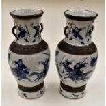 A pair of 20th Century Japanese large blue and white vases, depicting battle scenes