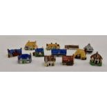 **AWAY**VENDOR COLLECTED 25/10/2019** A group of circa 1950's pottery miniature houses and