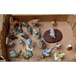 A collection of Beswick and Wade garden bird figures, along with a quantity of others (Q)