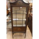 An Edwardian mahogany inlay glazed display cabinet on tapered supports