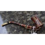 An 18th Century Whieldon style ceramic pipe with tortoiseshell style glaze