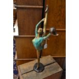 An Art Deco style figure in painted brass, approx 57 cms in height