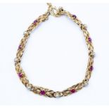 A ruby and pearl 9ct gold fancy-link bracelet, comprising pierced 9ct gold links set to the centre