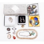A collection of costume jewellery to include a  Rennie Mackintosh silver brooch open work foliate