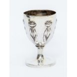 A Continental silver Art Nouveau egg cup with stylised tulips