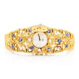 A circa 1960's 18ct yellow gold organic form bracelet dress watch, set with sapphires and