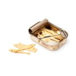 A Continental .800 silver novelty sardine tin with fixed opener, opened to reveal numerous bone fish