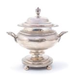 A Georgian style silver urn and cover, twin handled plain body on four bun feet, the domed cover