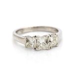 A diamond three stone platinum ring, three princess-cut diamonds total weight approx 1.75cts,