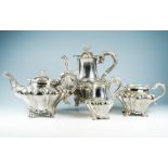 A Victorian four piece silver tea and coffee service, ogee shaped heavily chased with stylised