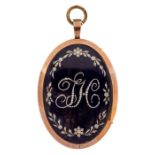 An 18th century gold framed oval mourning pendant, the engine turned blue enamel set with seed pearl