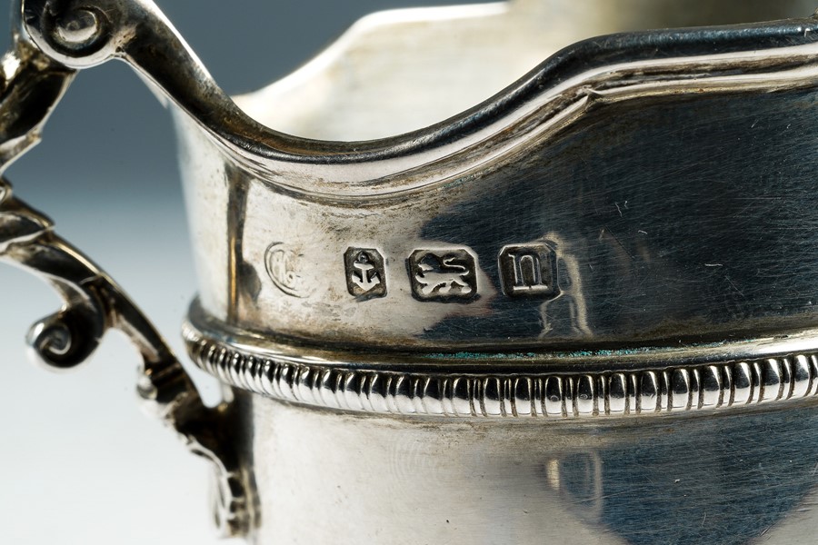 A George II style helmet shaped silver cream jug, shaped border above beaded mid rib, lower - Image 2 of 2