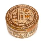 A 19th century Continental tortoiseshell circular snuff box, applied and pique gold work depicting