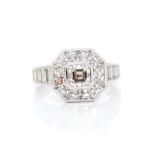 A diamond octagonal cluster white gold ring, diamond set shoulders, central square emerald-cut