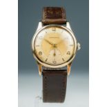 Garrard; a boxed 1960's 9ct gold gents Garrard wristwatch with provenance plus a 9ct and silver stud