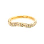 A diamond set 18ct rose gold ring, the shaped half hoop band grain set with a double row of a
