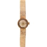 Omega, a circa 1960's lady's 9ct gold Omega wristwatch, 1.5cm circular dial, on an integral 9ct gold