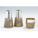 Stuart Devlin: A modern three piece silver and parcel gilt condiment set, plain bodies with lower