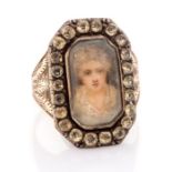 A late 18th/early 19th century gold and silver sentimental ring, set with a glazed compartment