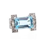 An Art Deco style platinum, aquamarine and diamond ring, the rectangular step cut aquamarine