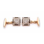 A pair of Edwardian diamond set chain cufflinks, the square fronts comprising five round old cut