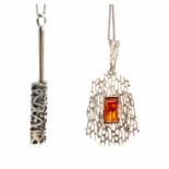 Two modernist silver pendants on chains, one of lattice form set with amber, probably Finnish, the