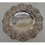 An Edwardian silver circular raised dish, the sides chased with fruit and foliage with openwork