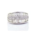 A diamond four-row half set 18ct white gold band ring, the front section comprising two central rows