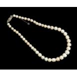 A single-row natural pearl necklace, the diamond-set clasp with French hallmarks, forty-five